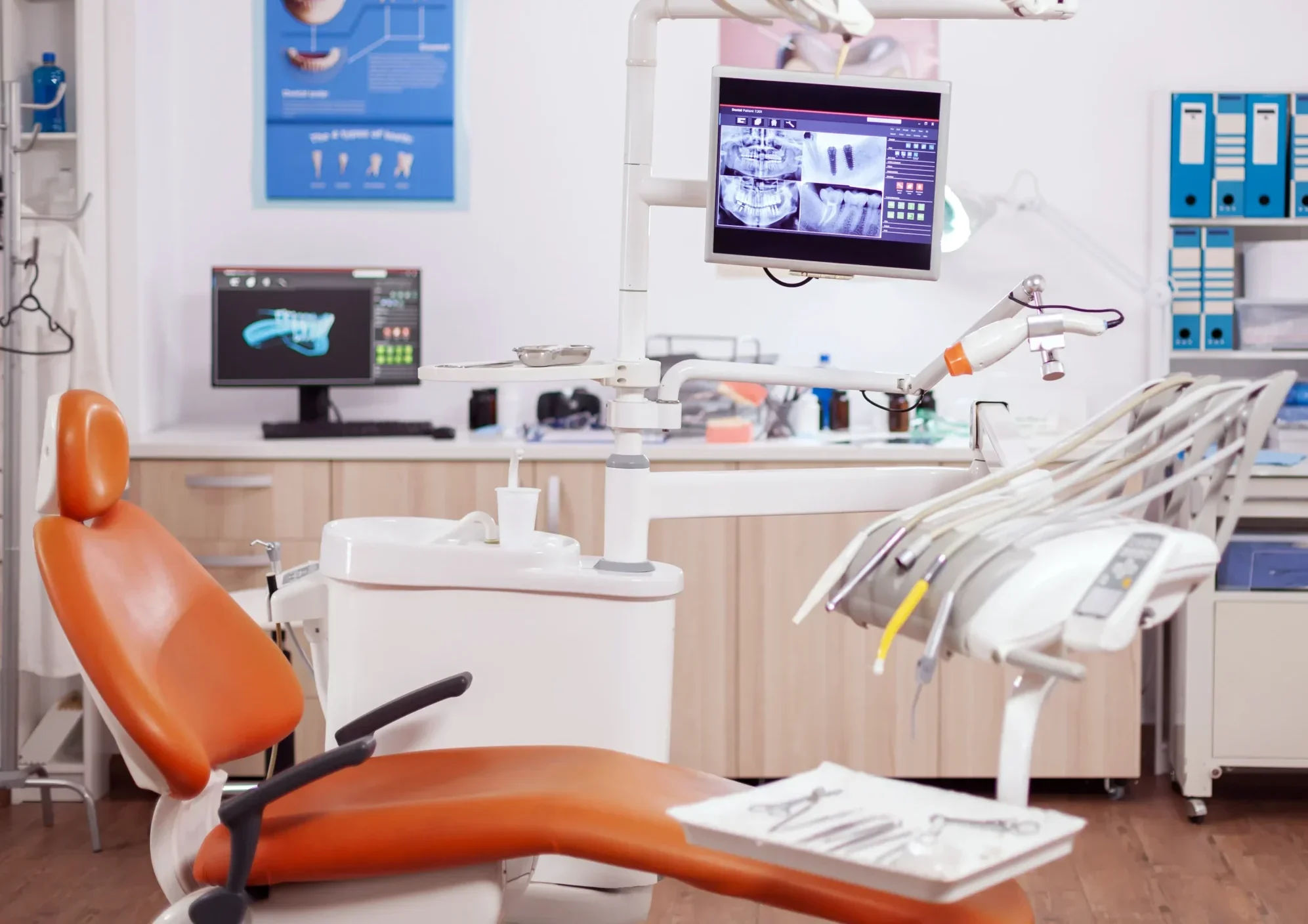 Dentist using digital imaging equipment to capture detailed dental scan in clinic