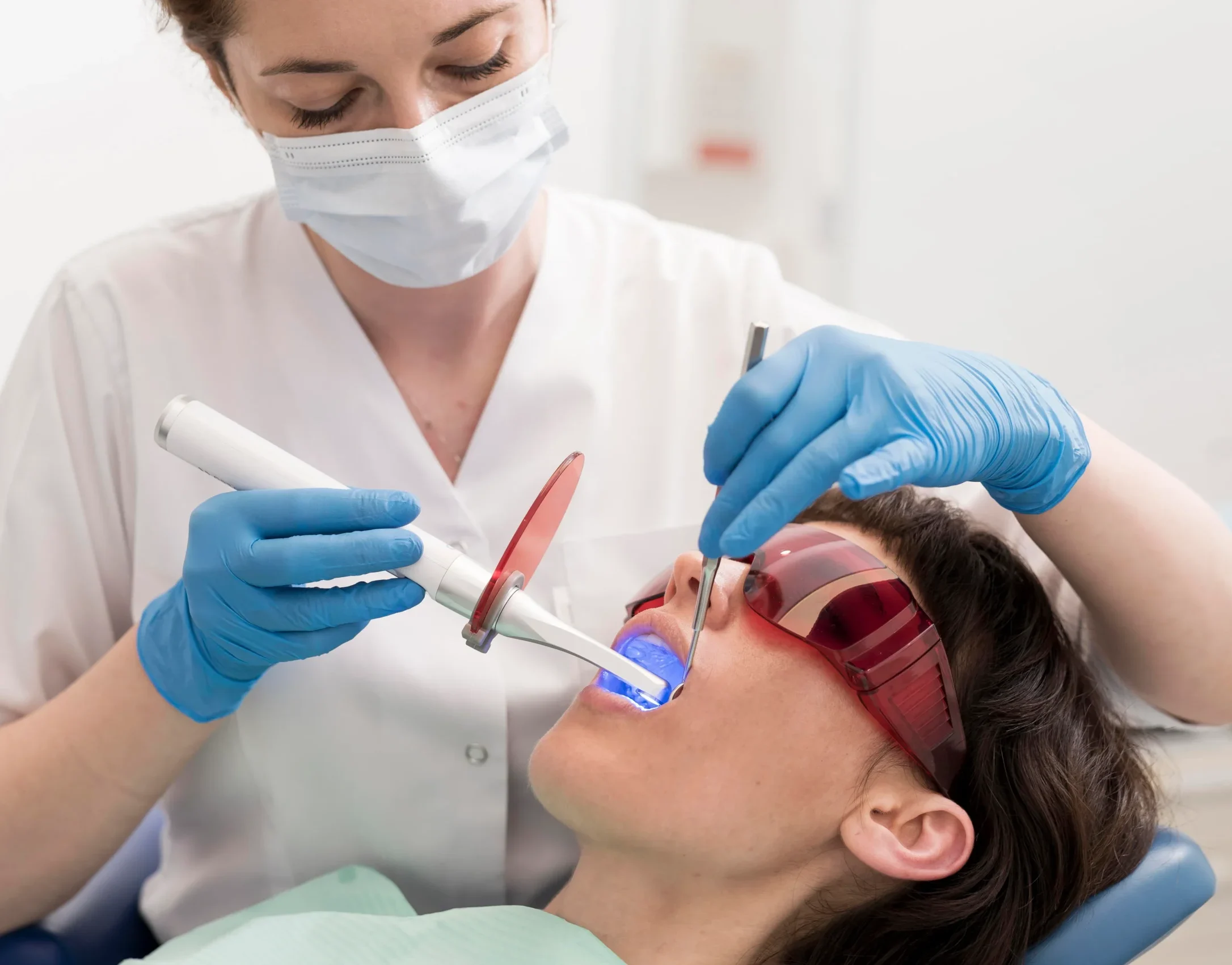 Dentist performing routine preventive dental checkup in clean modern clinic